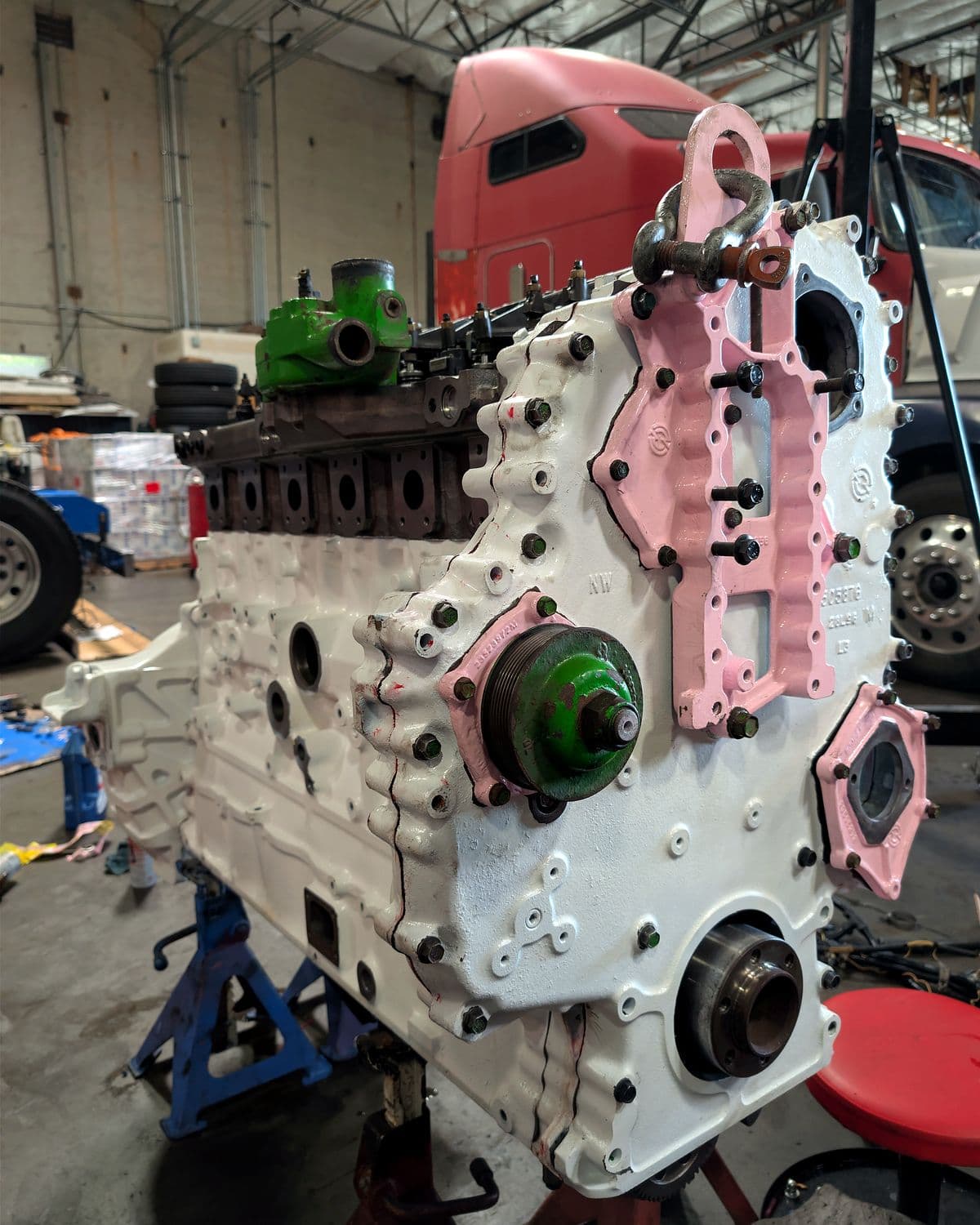 Heavy-duty diesel engine on a stand during a custom engine build for a semi truck