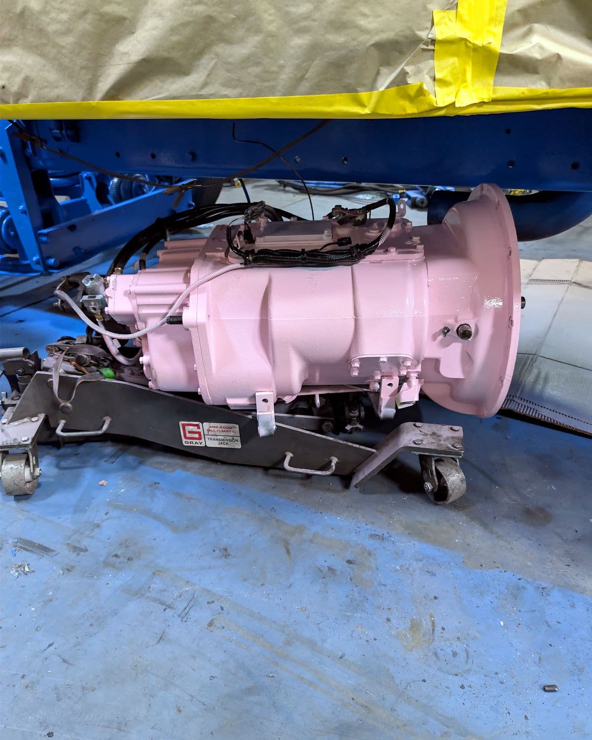 Transmission on a jack ready to be installed under a custom-built semi truck